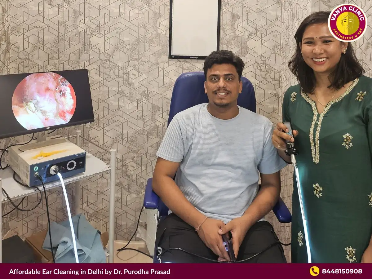 Dr. Purodha Prasad with Patient at her clinic.
