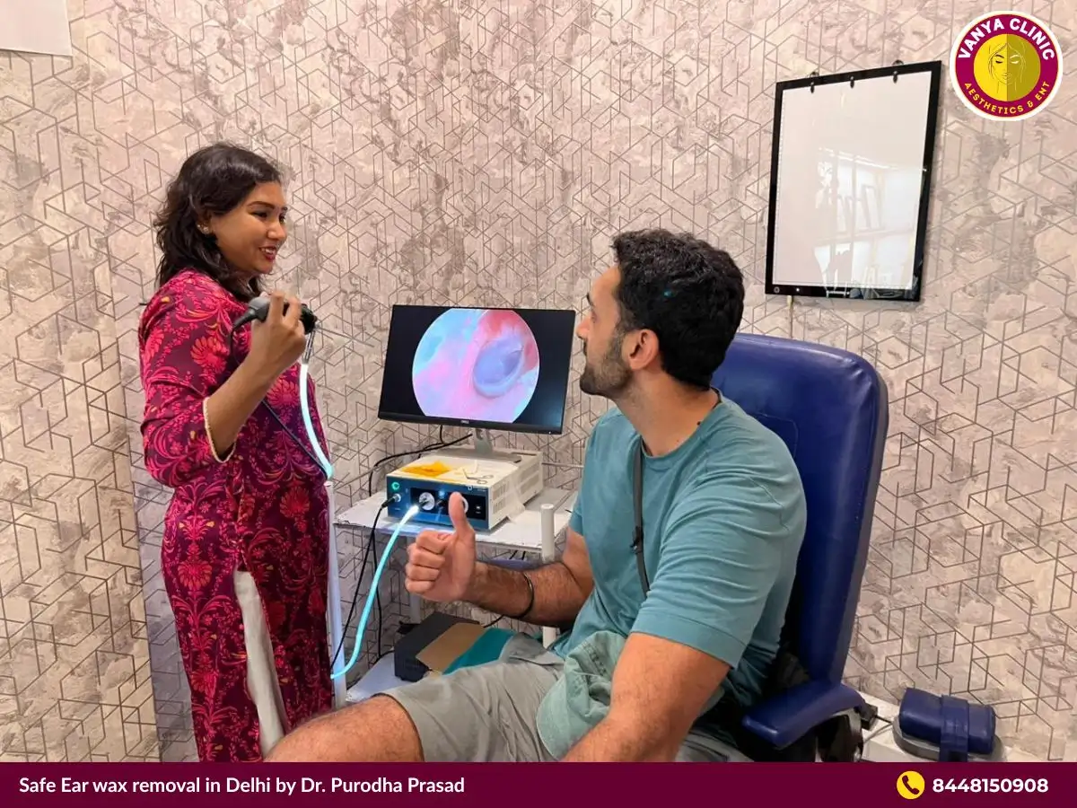 Dr. Purodha Prasad doing Ear wax consultation with patient.