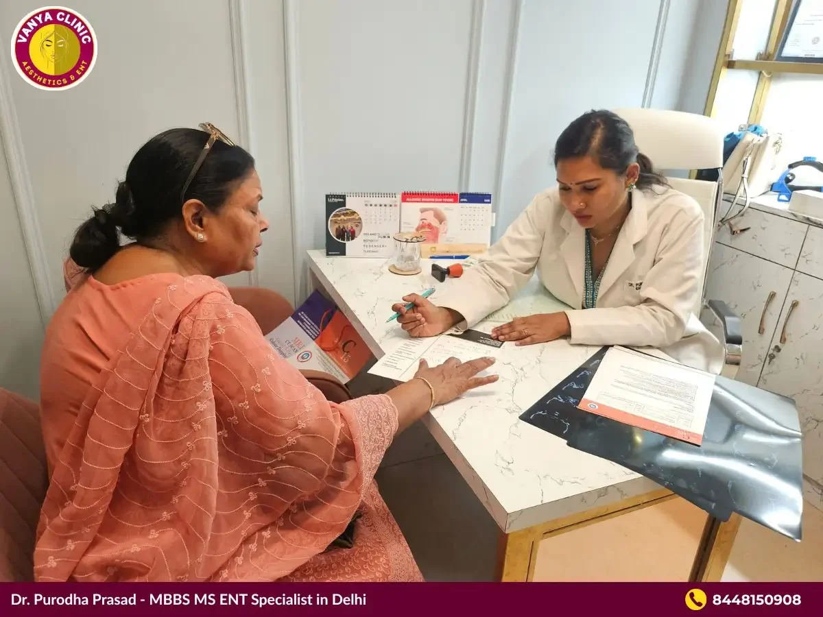 Dr. Purodha Prasad explaining cost aspect of foreign body removal to patient's relative.