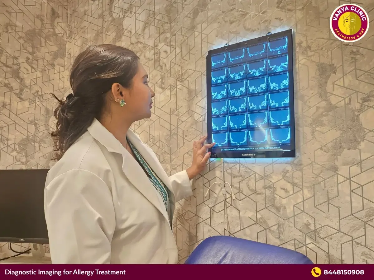 Dr. Purodha Prasad reviewing MRI scans of patient for chronic allergic rhinitis.