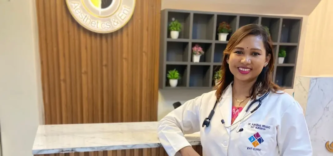 Dr. Purodha Prasad at reception desk of Vanya Clinic, Aesthetics & ENT.