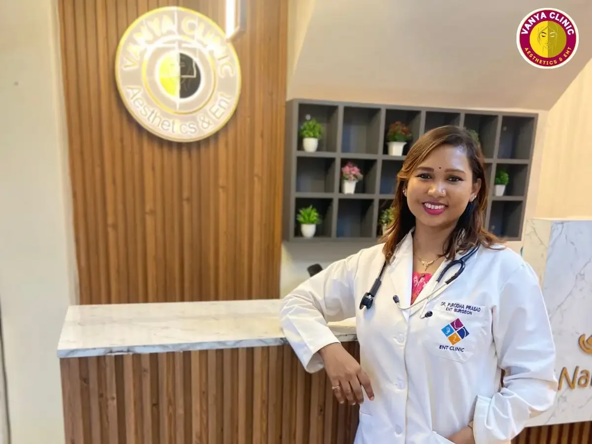 Dr. Purodha Prasad at reception desk of Vanya Clinic, Aesthetics & ENT.