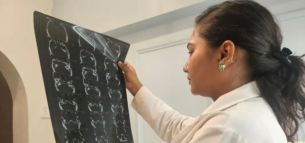 Dr. Purodha Prasad checking MRI Scans of Sinus surgery patient.