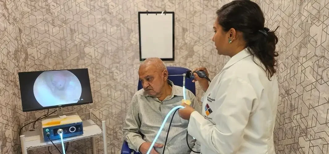 Dr. Purodha Prasad doing Endoscopic Ear checkup of elderly patient.