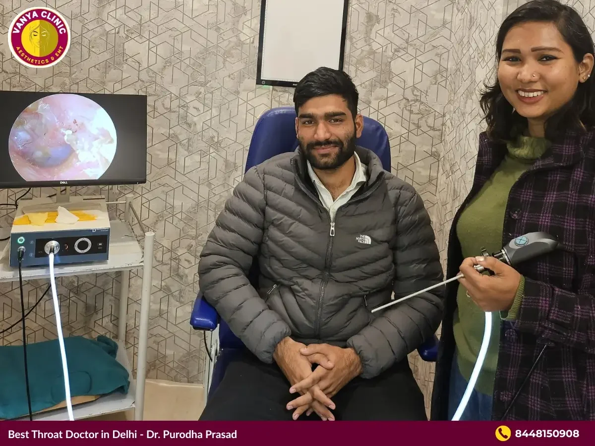 Dr. Purodha Prasad with Patient at her Throat Clinic.