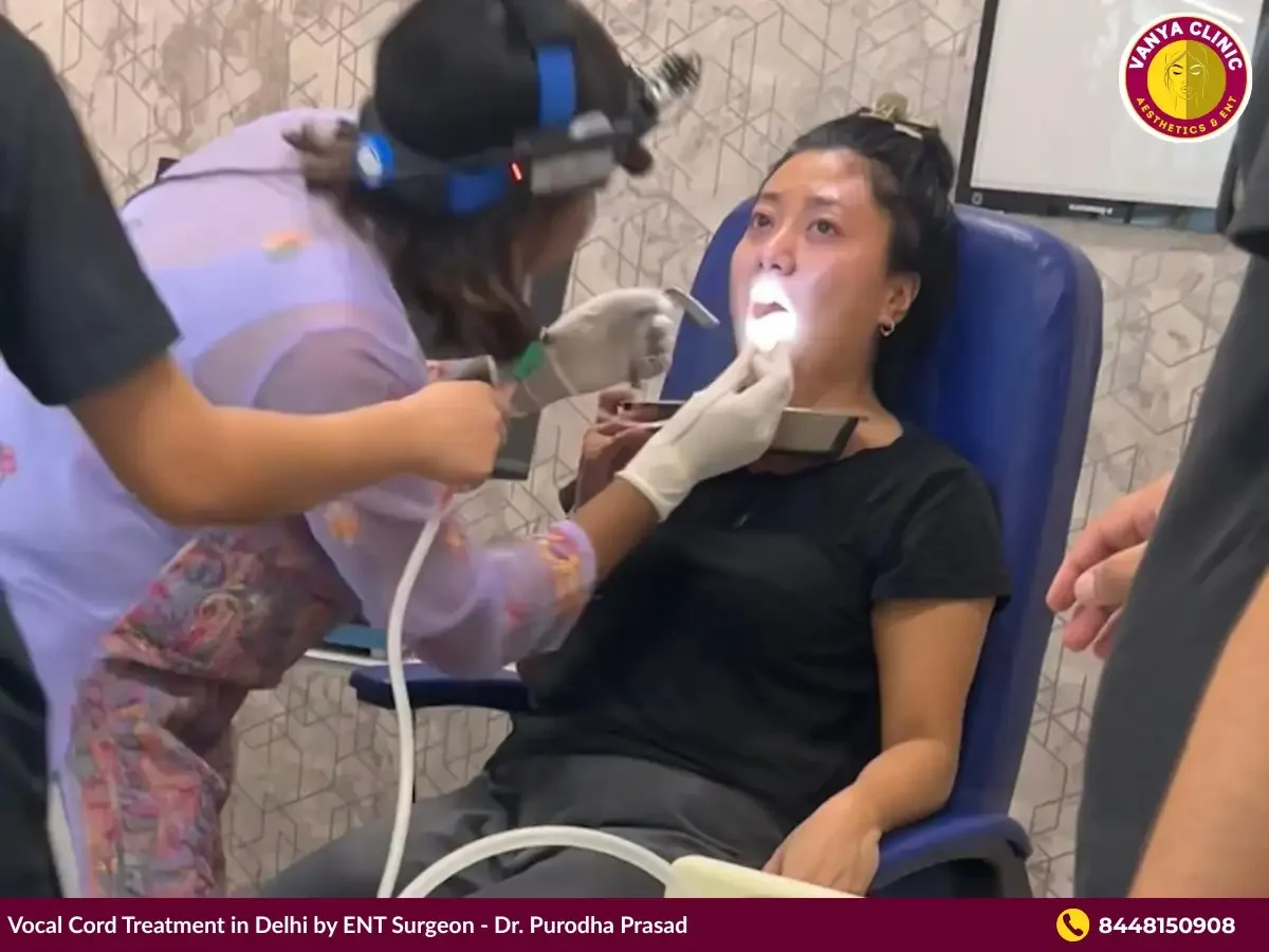 Dr. Purodha Prasad inspecting patient's vocal cord.